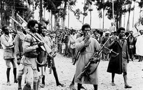 Ethiopian patriates holding machine guns captured from the enemy